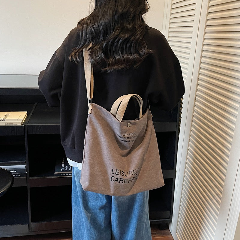 Large Capacity Canvas Crossbody Bag for Men and Women 2026 Stylish Lightweight Daily Commuting Shoulder Bag Durable Student Book Tote with Multiple Pockets Ideal for Work School Travel and Everyday Us