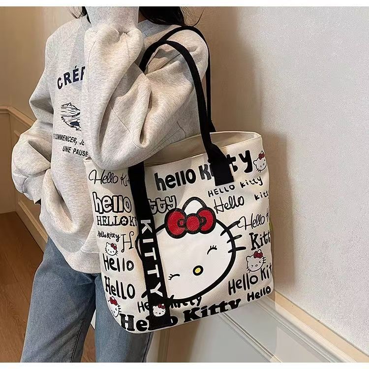 Korean Style Cute Hello Kitty Canvas Tote Bag for Women Fashionable Cartoon Printed Shoulder Bag Casual Office Commuting Crossbody Bag Lightweight Durable Everyday Use
