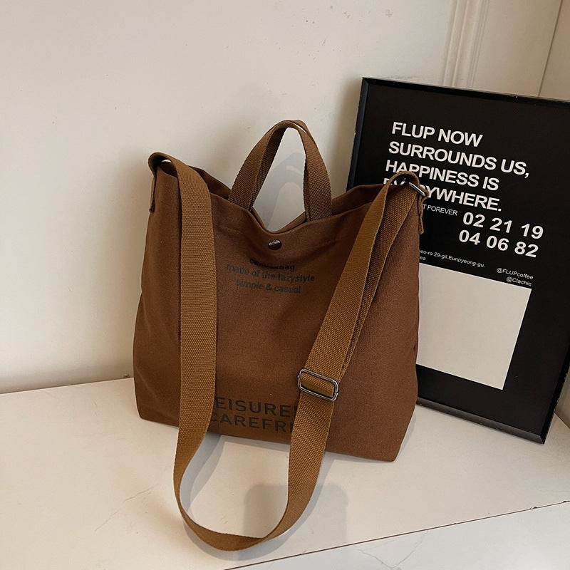 Large Capacity Canvas Crossbody Bag for Men and Women 2026 Stylish Lightweight Daily Commuting Shoulder Bag Durable Student Book Tote with Multiple Pockets Ideal for Work School Travel and Everyday Us